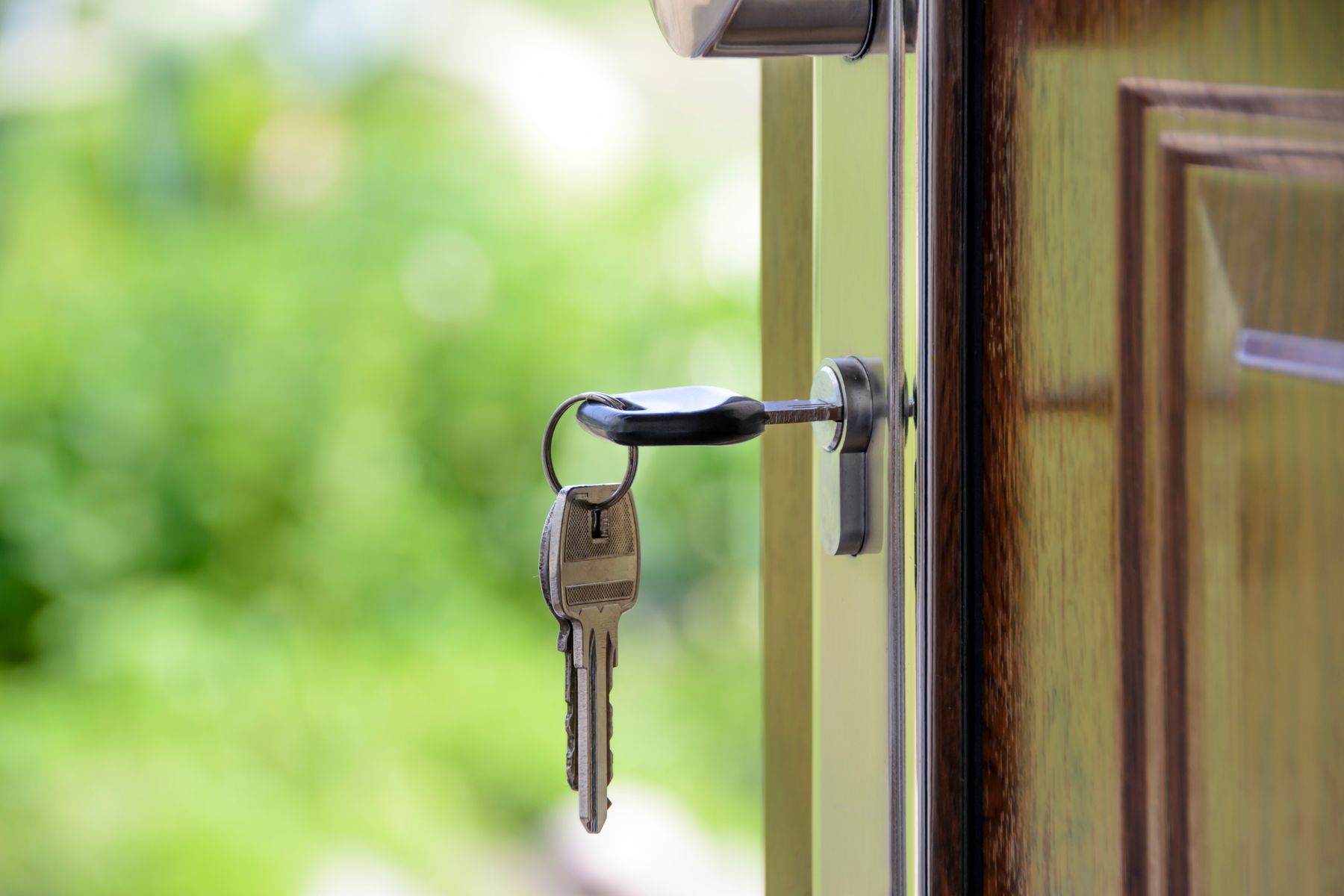 Black-handled key in a keyhole